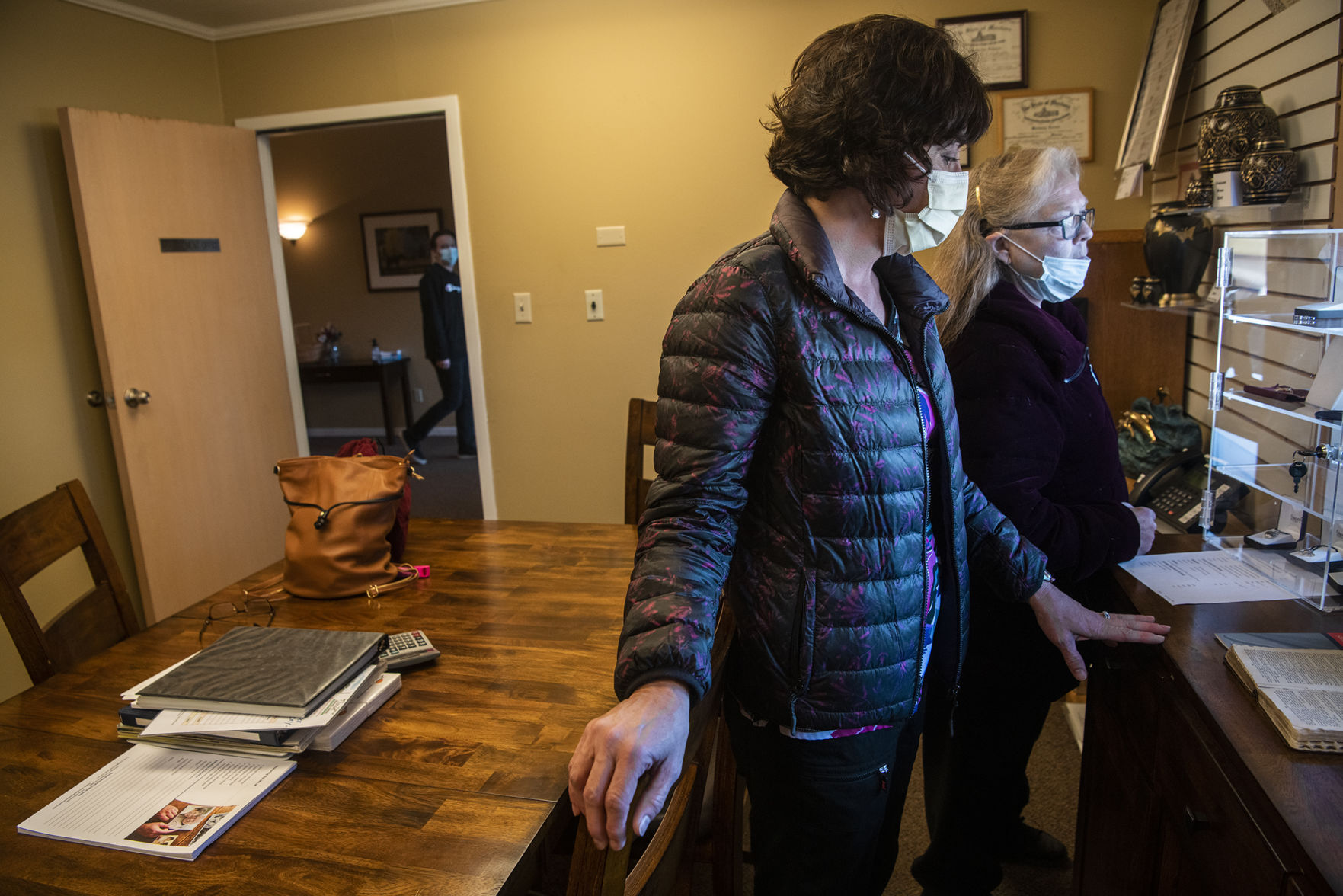Dorothy Williams and Peggy Love wait for Lee’s ashes